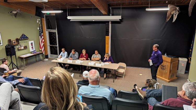 Matthew Kirk, associate professor of geology (far left), highlights groundwater research during community visit panel that highlighted water projects and resources in the Barton County region. 