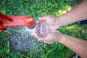 Water and hands at spigot