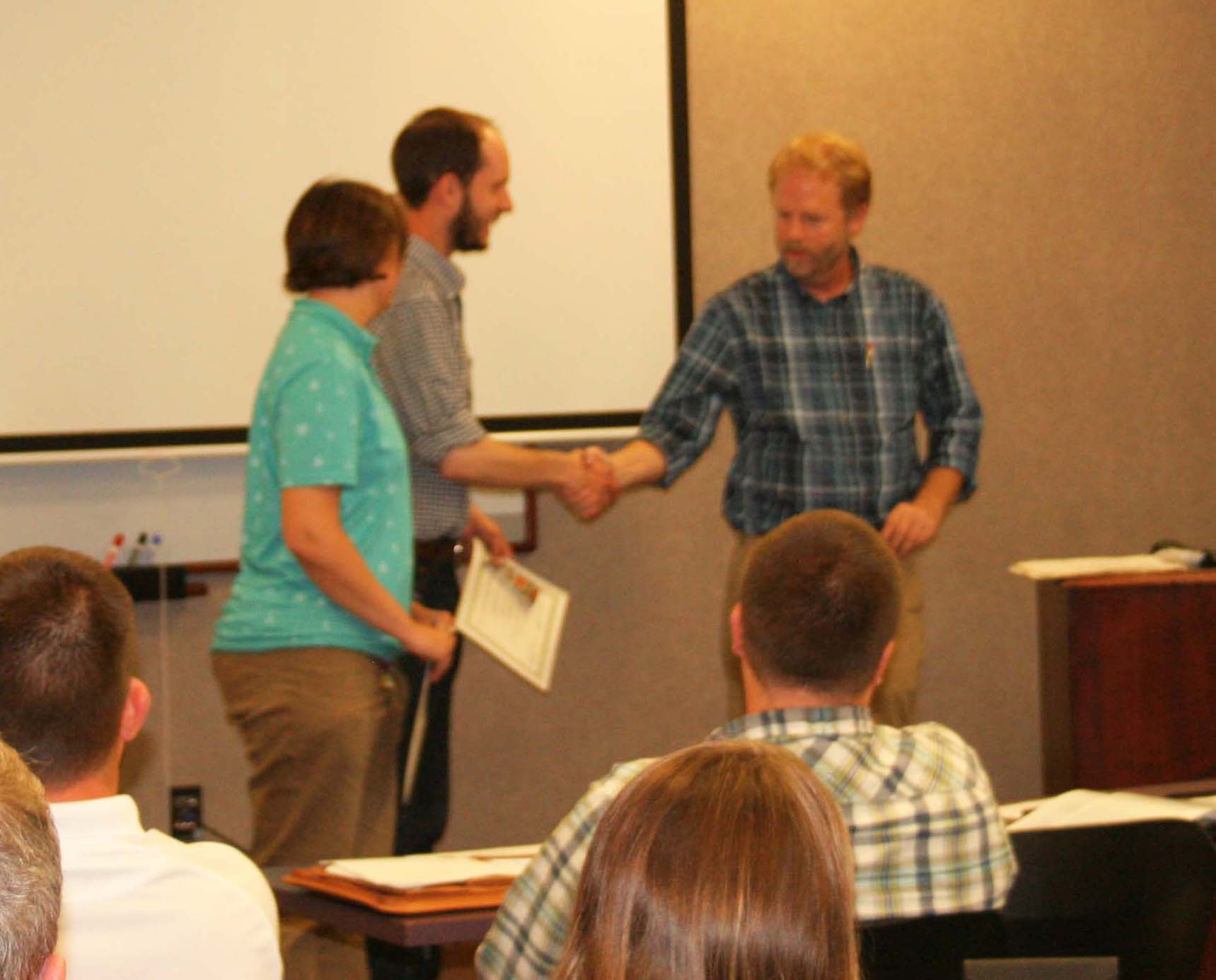 Carly Aulicky and Liam Berigan Receiving the Outstanding Student Award for 2019