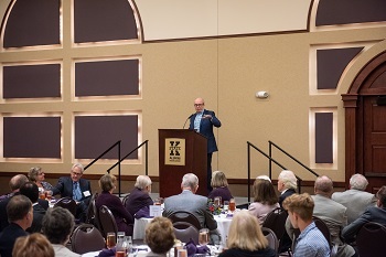 Alan Murray speaking to patrons