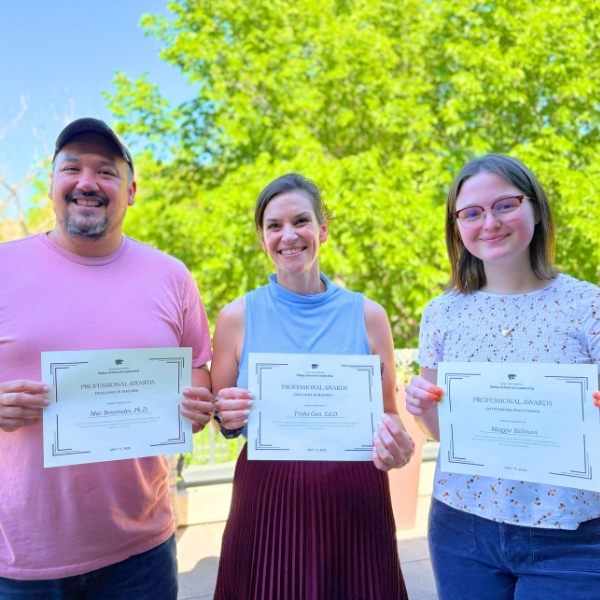 Awardees pose with certificates