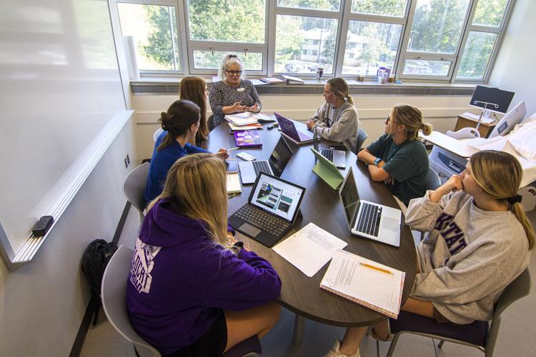 instructor collaborating with students