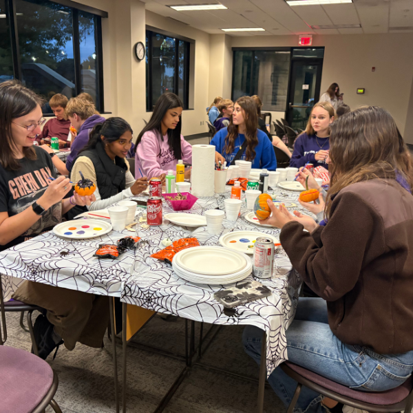 UHP students painting pumpkins at UHAT 2025 fall fest