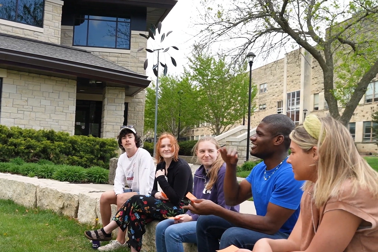Student in discussion group outside