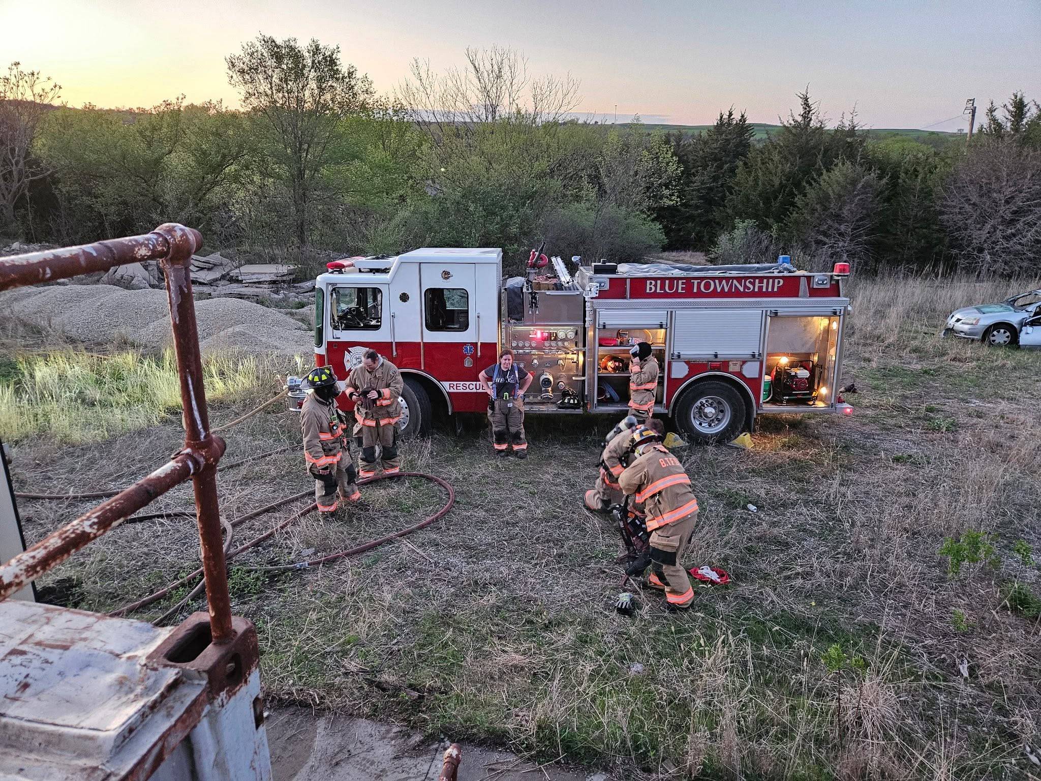 Firefighters working in front of fire truck Firefighters working in front of fire truck