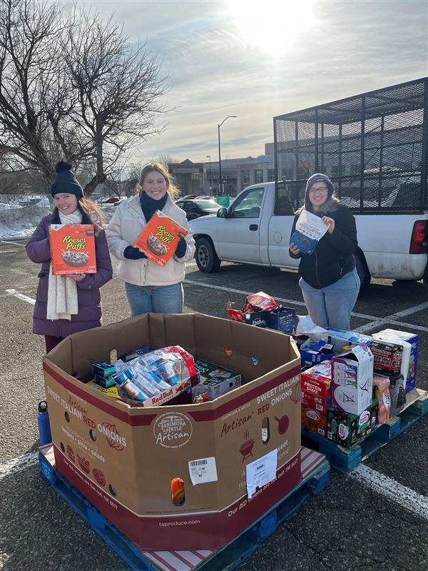 Volunteers holding food