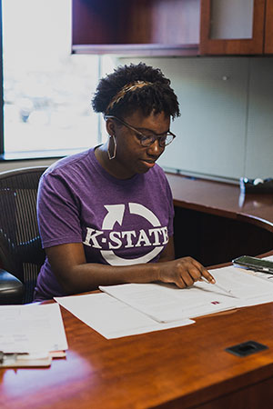 Student peer coach at desk