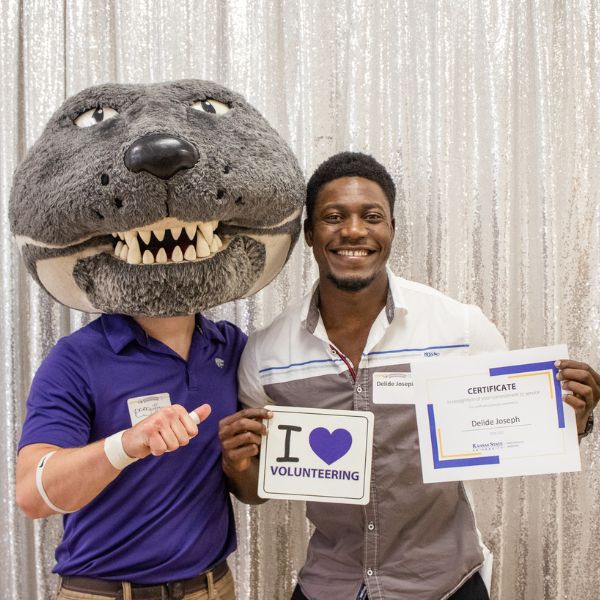 Willie Wildcat with volunteer