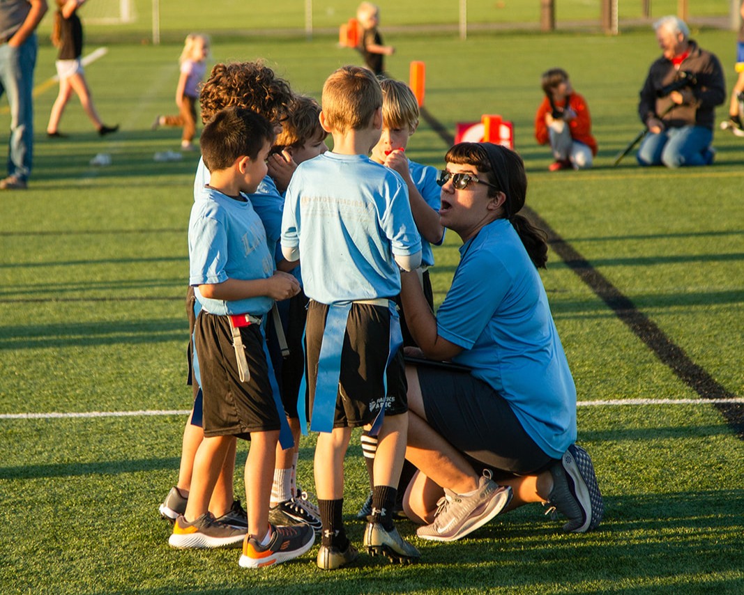 Snyder Fellow coaching youth soccer team on field
