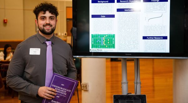 Student with research poster