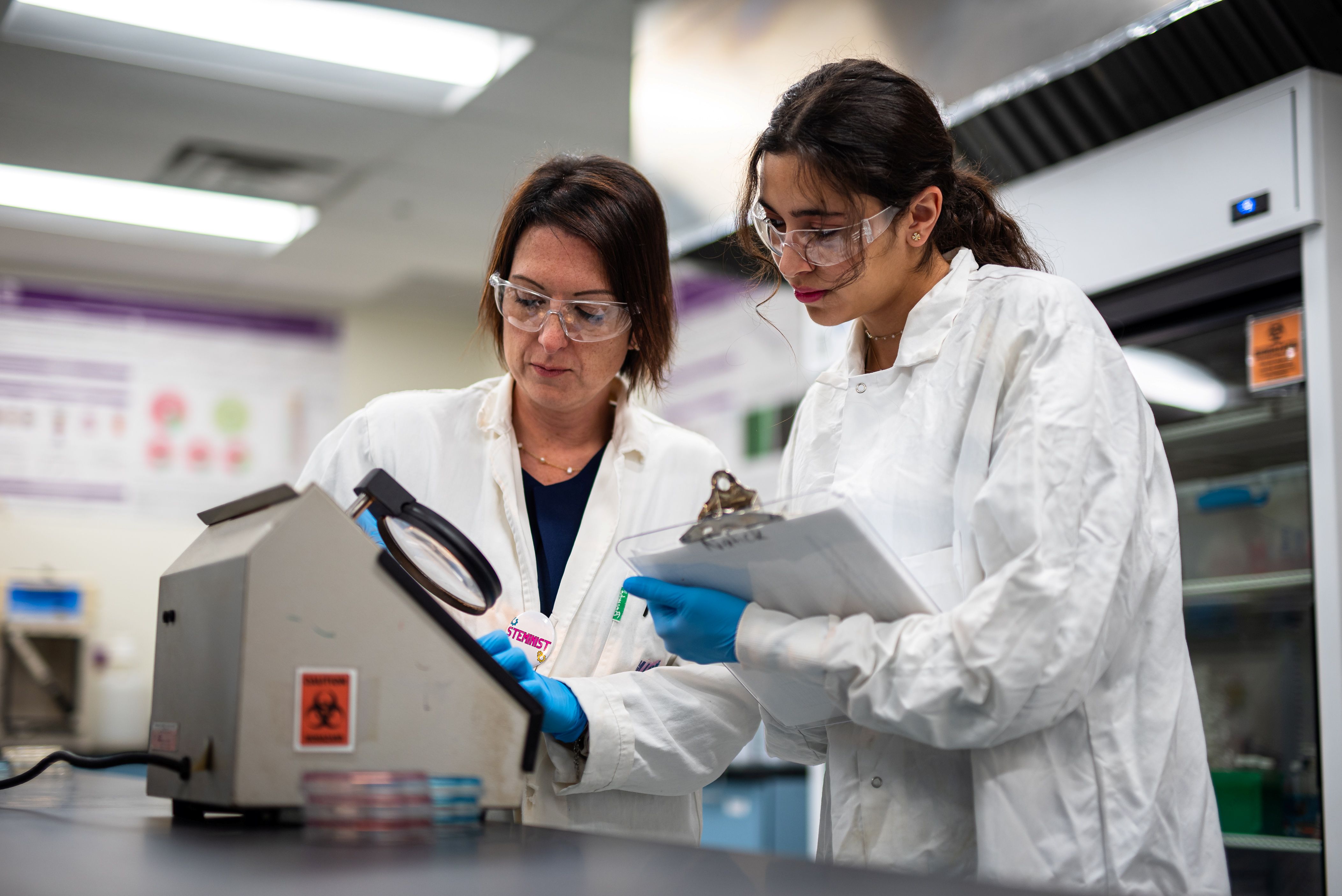 Student and faculty working in lab