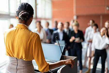 woman speaking at conference