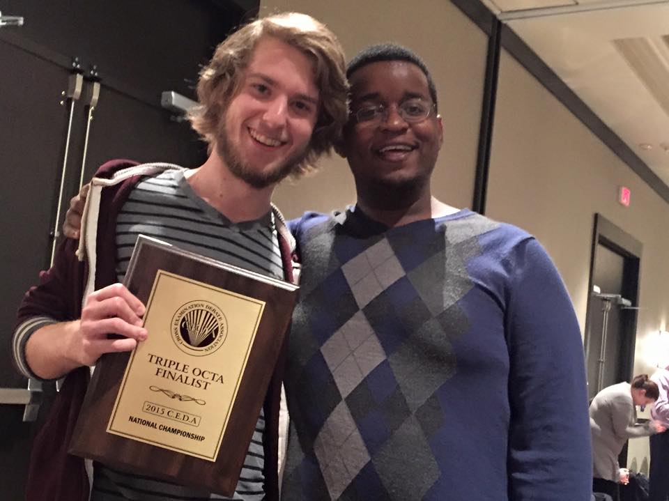 Students holding debate award