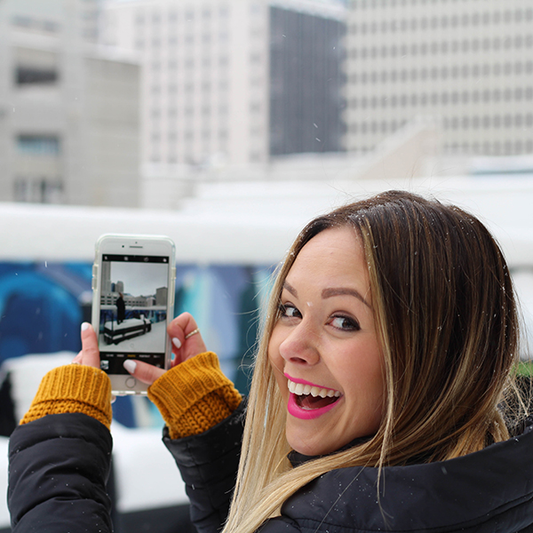 student on a cell phone outside