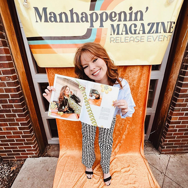 female holding up magazine at Manhappenin Launch Event