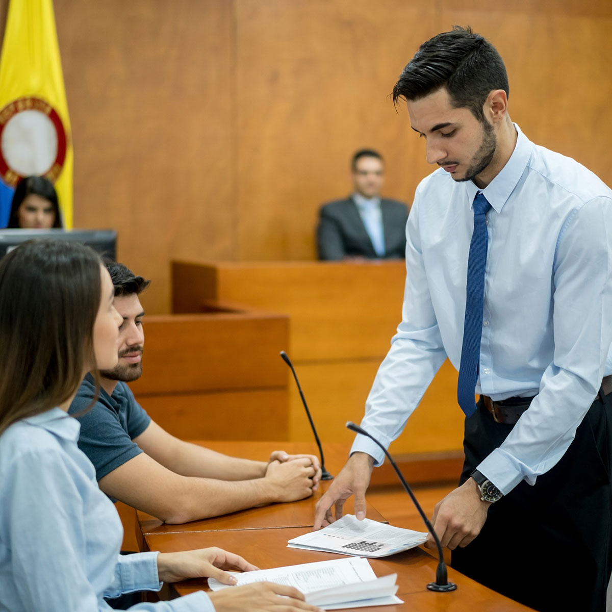 students taking part in a mock trial in a courtroom