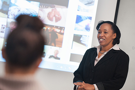 woman professor speaking to class