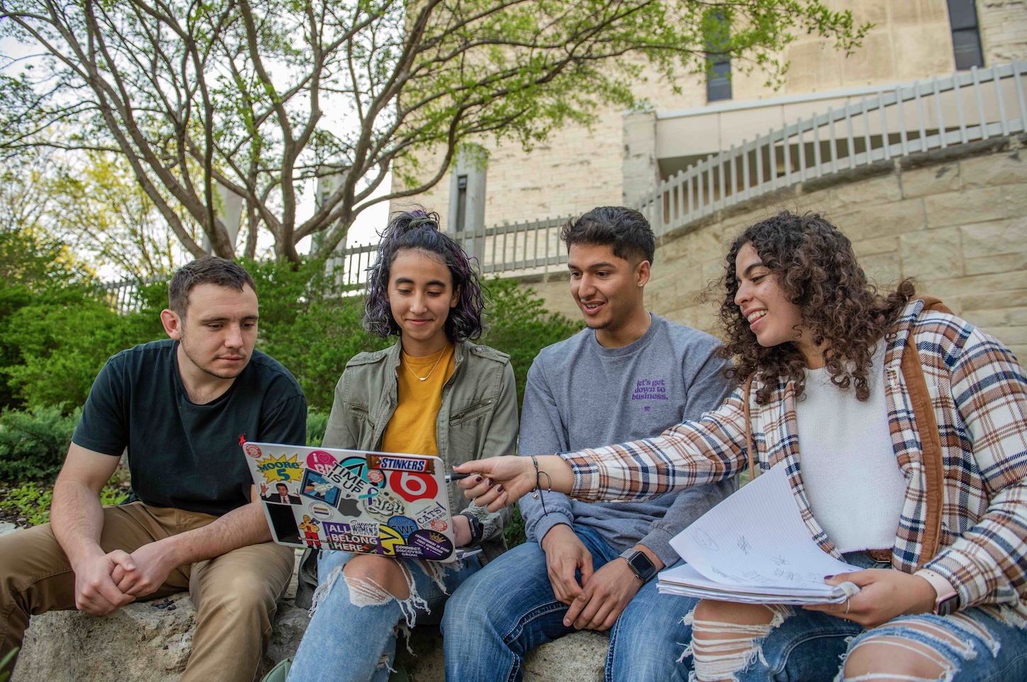 4 students working on campus