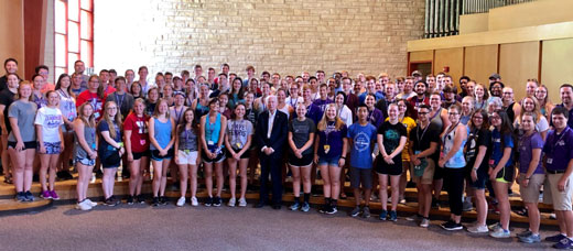 2019 Leadership Auxiliary Camp participants pose with Coach Bill Snyder