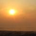 An unmanned aircraft flies through the smoke over a tallgrass prairie prescribed burn as the sun sets. Kansas State University researchers have attached sensors on unmanned aircraft to gather air quality information during burns. | Photo credit: Douglas Watson, Kansas Department of Health and Environment