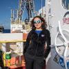 Aida Farough, a Kansas State University teaching assistant professor of geology, stands on board the U.S. research drilling vessel called the JOIDES Resolution. Farough spent two months on a research cruise to study the mineral resources near Brothers volcano in the Pacific Ocean northeast of New Zealand.  |  Photo credit: Bill Crawford, International Ocean Discovery Program