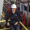 Aida Farough, a Kansas State University teaching assistant professor of geology, stands on board the U.S. research drilling vessel called the JOIDES Resolution. Farough was selected as one of 11 researchers from the U.S. for the two-month research cruise, which focused on Brothers volcano in the Pacific Ocean and marked the first attempt to drill into a submarine volcano.  |  Photo credit: Aida Farough, Kansas State University