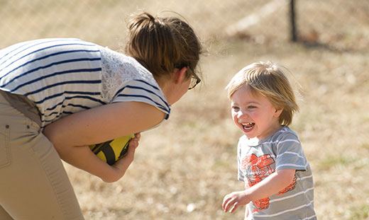 Child and adult playing