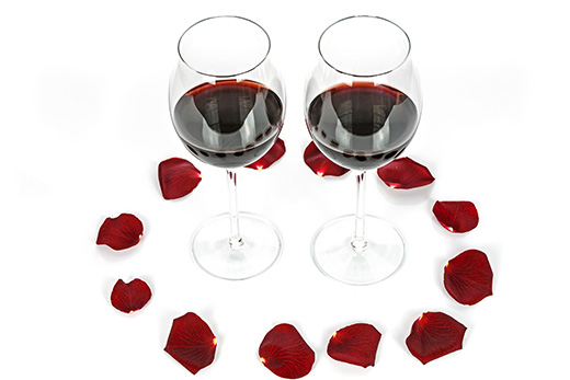 Wine glasses with rose petals