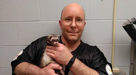 Owner Carl Hobi and his ferret Zelda 