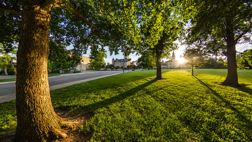 Sun setting behind Anderson Hall