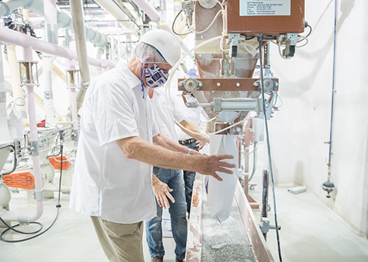 person in flour mill