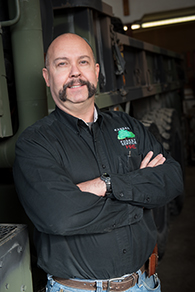 Eric leaning on truck