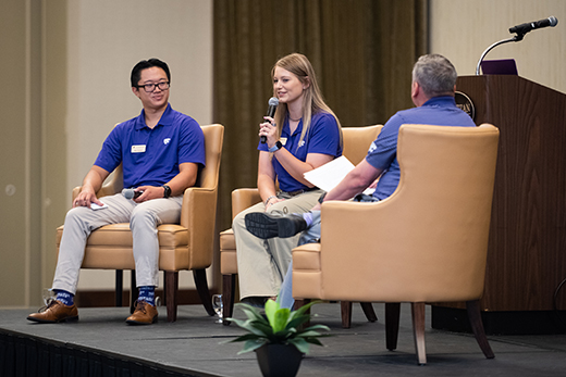 In this photo, Kady Figge tells her K-State story at the Flint Hills community visit open forum. 