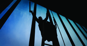 A worker replaces windows in Seaton Court