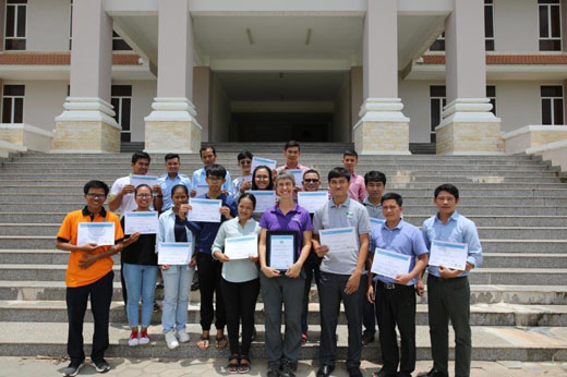 Short course attendees hold certificates at Royal University of Agriculture. 