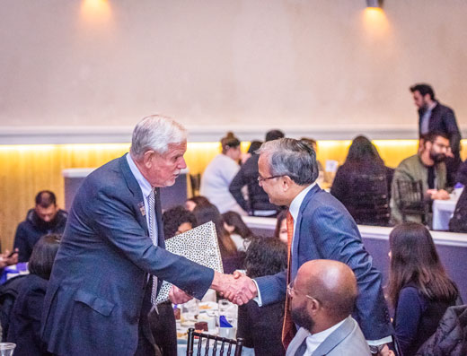 President Richard Myers shakes hands with Ambassador Asad Majeed Khan.