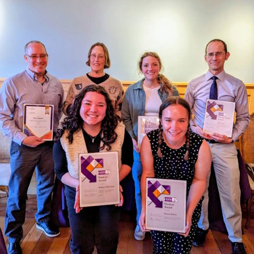 Six K-State First award winners hold up their certificates. 