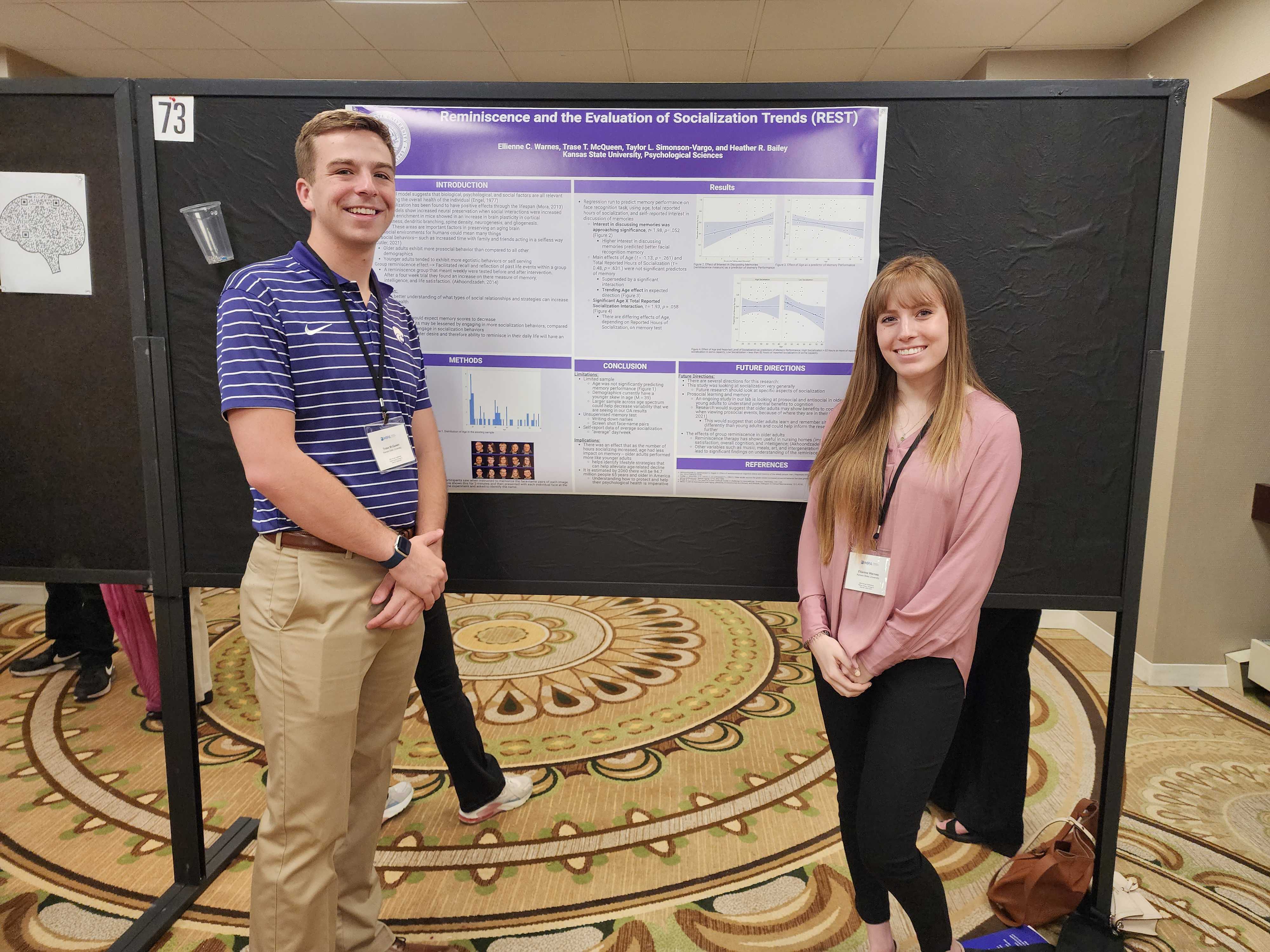 These are undergraduates, Ellie and Trase, presenting their poster called "Reminiscence and the Evaluation of Socialization Trends (REST)".