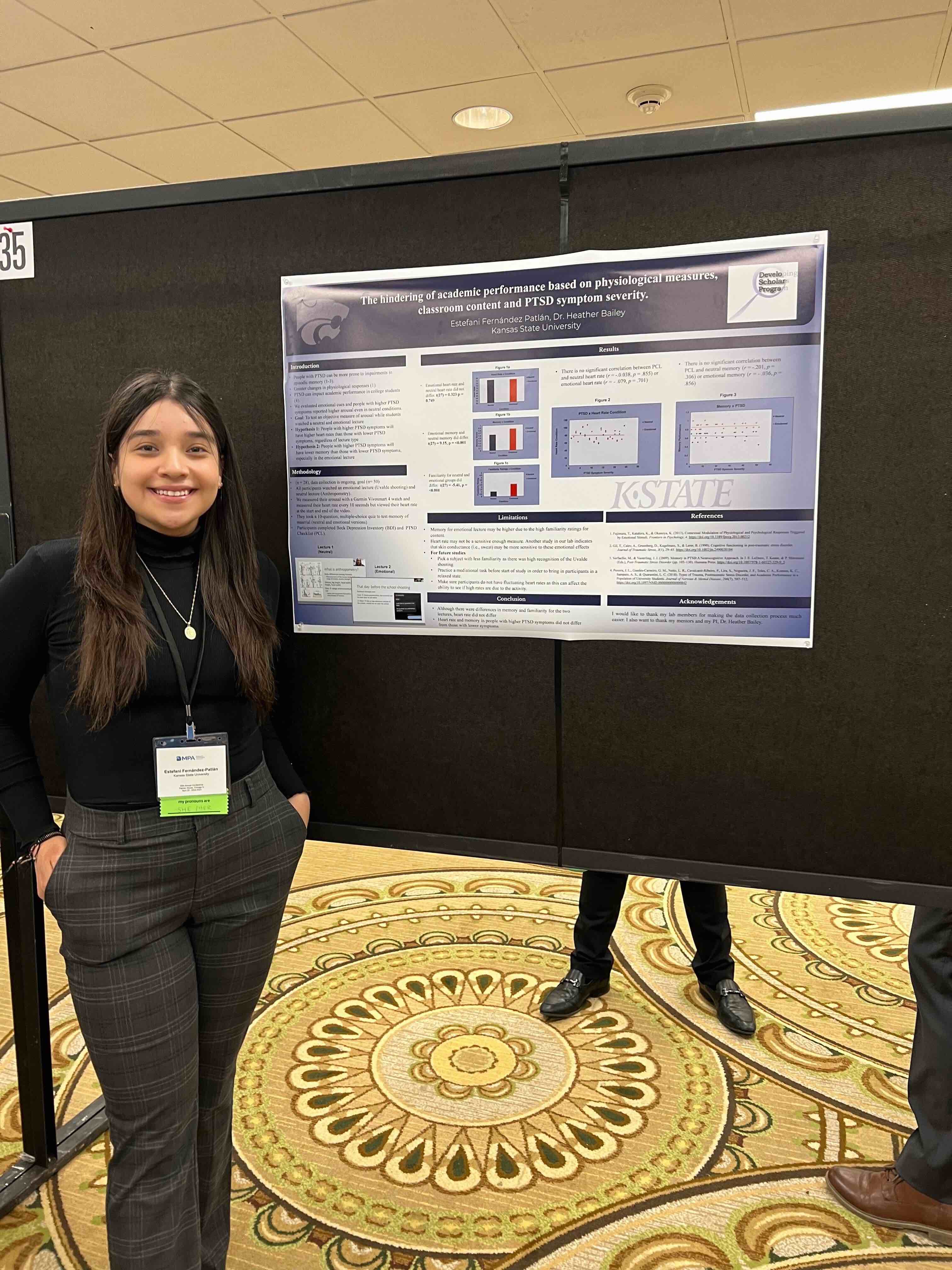 Estefani is presenting her poster titled "The hindering of academic performance based on physiological measures, classroom content and PTSD symptom severity."