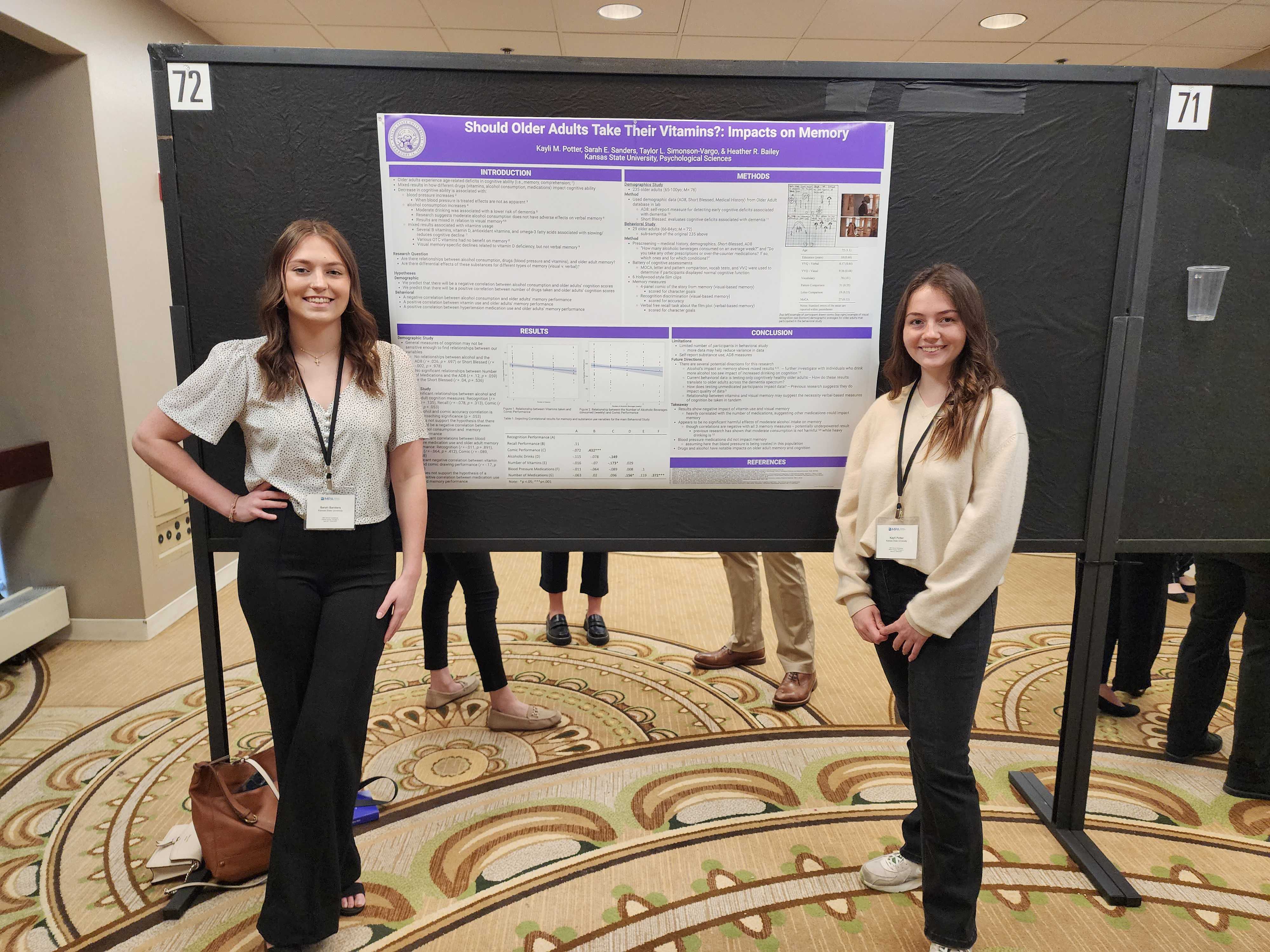 These are undergraduates, Sarah and Kayli, who are presenting their poster titled "Should Older Adults Take Their Vitamins?: Impacts on Memory".
