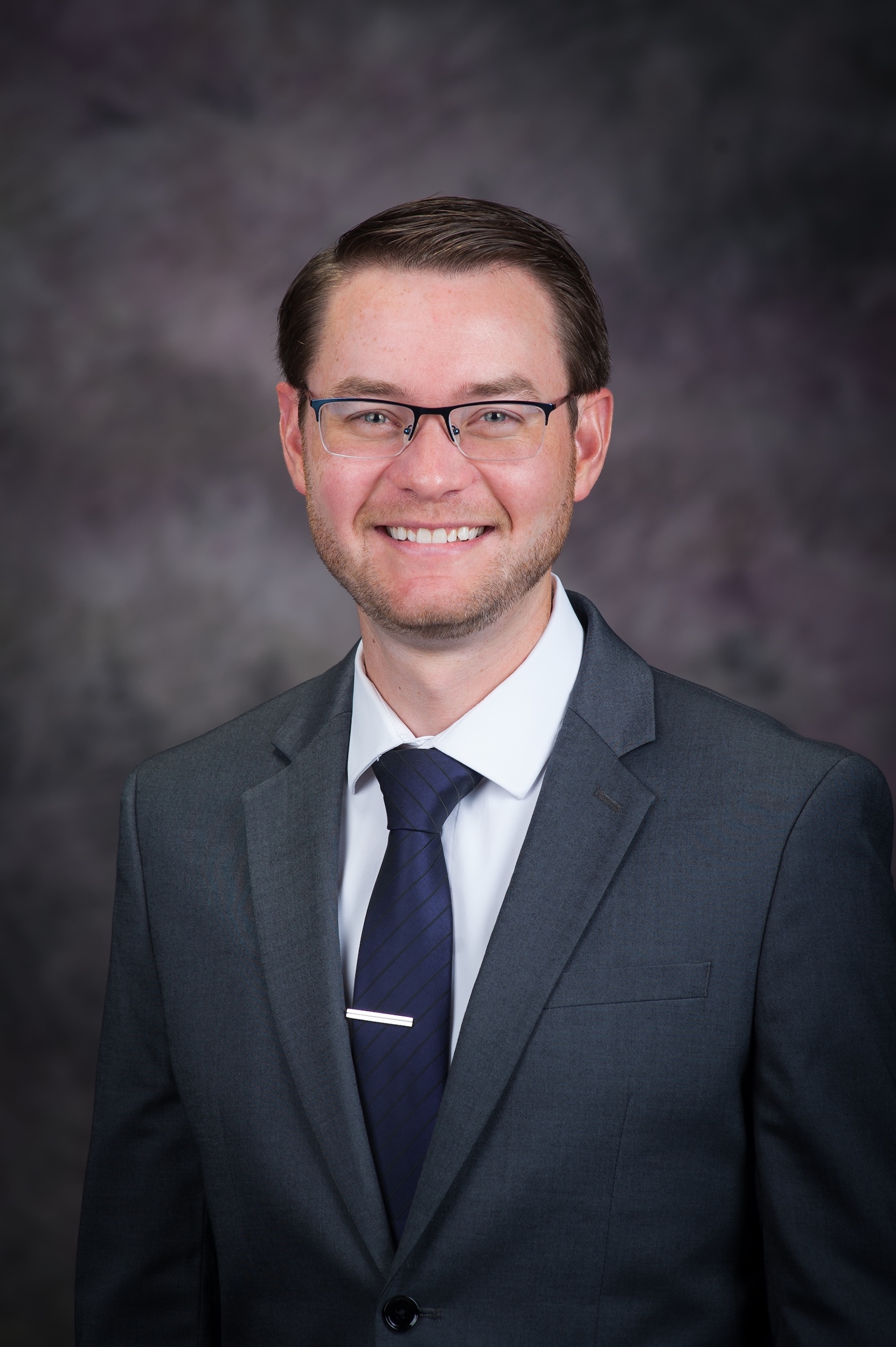 headshot of Bryan Pinkall with black background