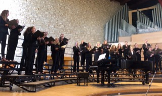 treble choir on risers with piano in front
