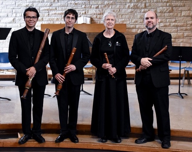 four individuals holding recorders