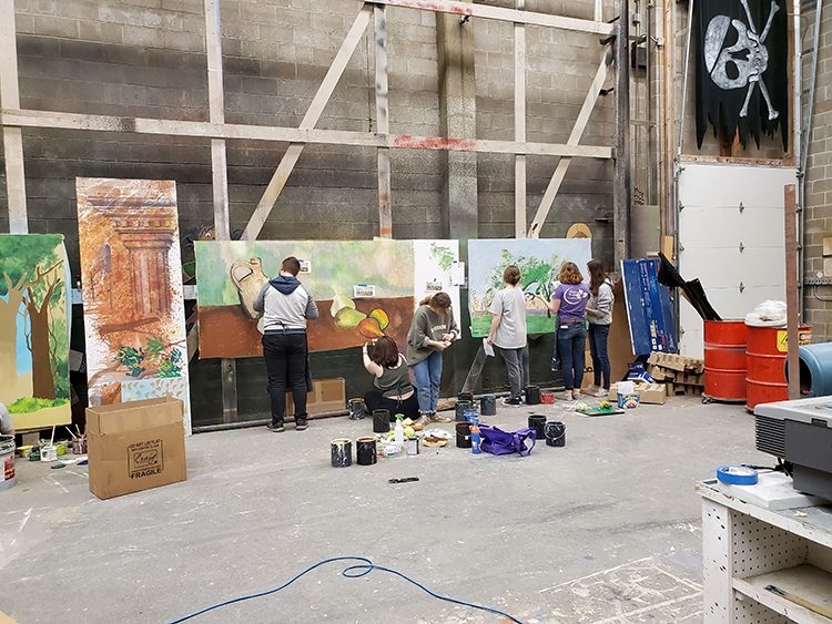 Students working in the scene shop