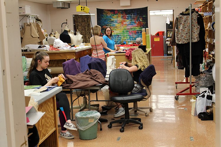 Students working in the costume shop