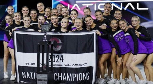 Photo of Classy Cats posing with national champion banner