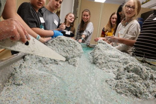 photo of girls playing with sand