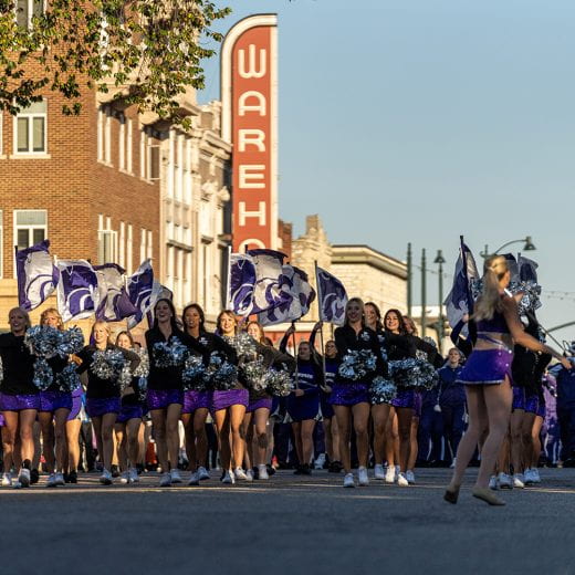Cheerleaders walking in Homecoming 2023 parade