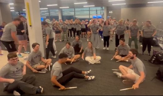 k-state marching band performs while delayed at airport