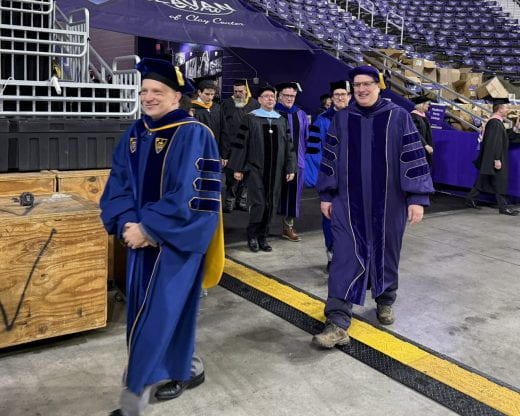 faculty members process into ceremony